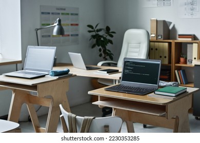 Desks with computers for IT lesson