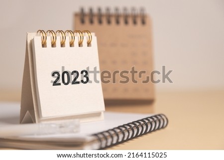 Desktop calendar for 2023 on a beige background. goals and plans on next year.