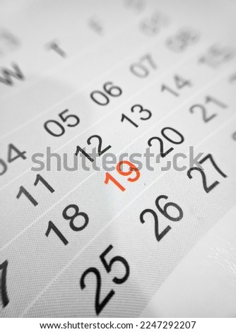 Desktop calendar dates selective focus 19 dates red color close up, 2023 concept photo