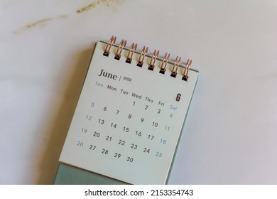 Desktop calendar for June 2022 on a light background