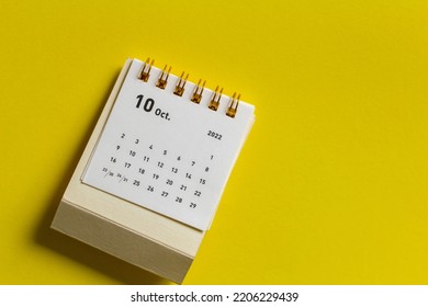 Desktop Calendar For October 2022 On A Yellow Background.