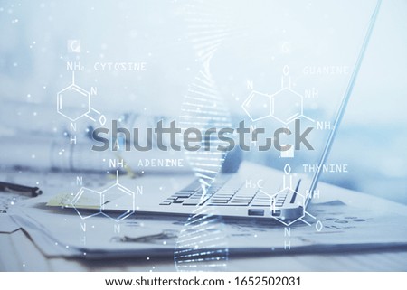 Desktop computer background and DNA drawing. Double exposure. Science concept.