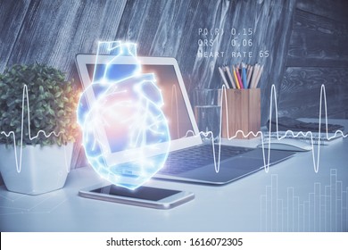 Desktop computer background and heart drawing. Double exposure. Medical study and healthcare concept.