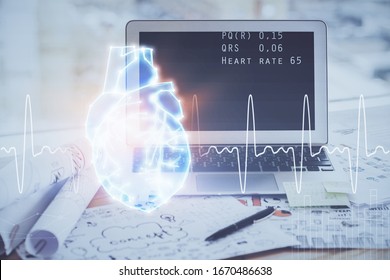 Desktop computer background and heart drawing. Double exposure. Medical study and healthcare concept.