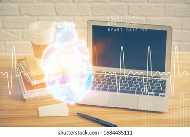 Desktop computer background and heart drawing. Double exposure. Medical study and healthcare concept.