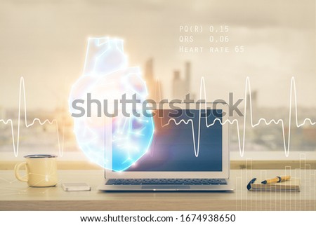 Desktop computer background and heart drawing. Double exposure. Medical study and healthcare concept.