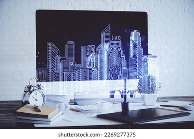 Desktop computer background in office and big town buildings hologram drawing. Double exposure. Smart city concept.
