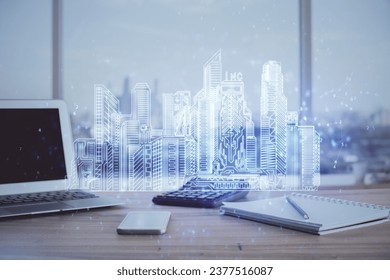 Desktop computer background in office and big town buildings hologram drawing. Double exposure. Smart city concept.