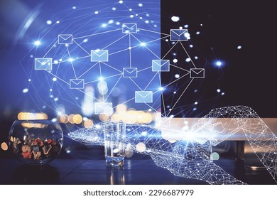 Desktop computer background in office and flying envelops hologram drawing. Double exposure. Electronic mail concept.