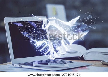 Desktop computer background in office and handshake hologram drawing. Double exposure. Pertnership concept.