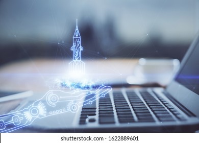 Desktop computer background in office and start up theme hologram drawing. Double exposure. Startup concept.