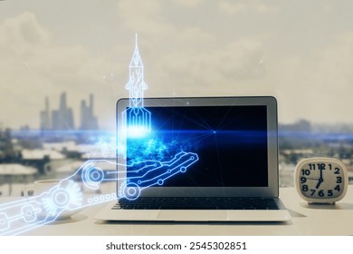 Desktop computer background in office and start up theme hologram drawing. Double exposure. Startup concept.