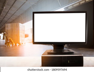 Desktop computer blank screen on table in distribution warehouse.  Shipment, Cargo freight load into container truck. Inventory management.