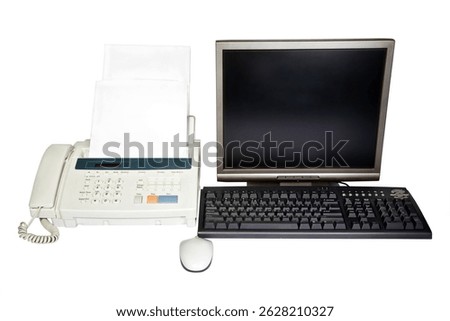Desktop computer and a fax machine.
