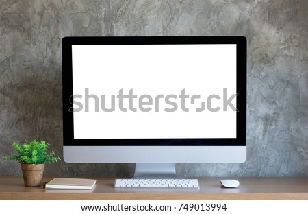 Desktop computer on work desk with blank screen