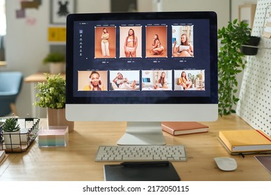 Desktop Computer With Photo Editing Software On Desk