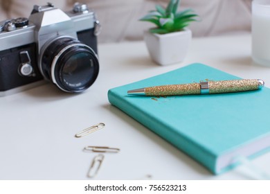 Desktop with journal and camera