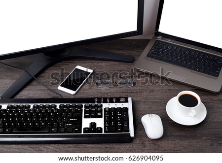 Desktop in modern loft interior with advanced computer for perfect creative freelance work and stationary, mock up PC standing near cup of coffee and croissant for breakfast in co working office