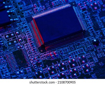 Desktop processor of a personal computer, laptop on the motherboard. Blue neon lighting. New technologies, engineering, electronics, computer industries, cyber security.