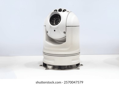 Desktop security camera. Dome CCTV with 360 degrees rotation function. Security camera fixed on white. IP CCTV for monitoring employees. Dome CCTV camera with visor. Equipment for video surveillance
