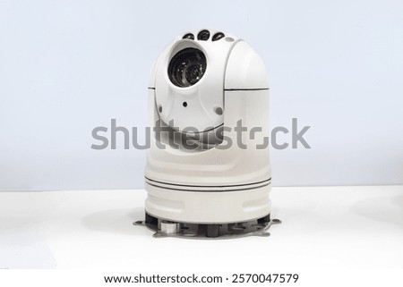 Desktop security camera. Dome CCTV with 360 degrees rotation function. Security camera fixed on white. IP CCTV for monitoring employees. Dome CCTV camera with visor. Equipment for video surveillance