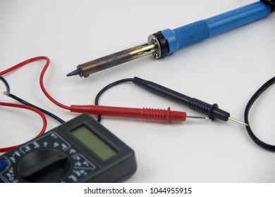 Desktop With Tools. Tester, Multimeter, Screwdrivers, Soldering Iron.