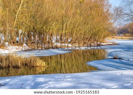 Desna river is ice-covered in early spring 
