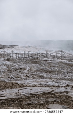 Desolate and alien volcanic crust smoking with geothermal heat in Iceland, inspiring a deep sense of solitude, mystery, and primal earth origins.