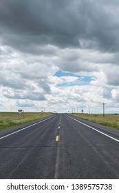Desolate road under a cloudy sky