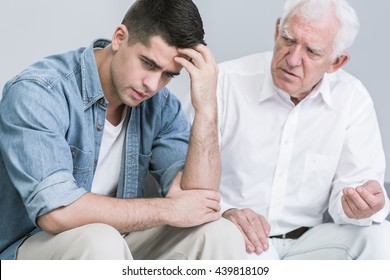 Despair Young Man And His Good Old Father Giving Him Advice