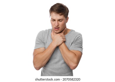 Despaired millennial european handsome guy presses his hands to throat and suffocates, isolated on white background. Choke, asthma, covid-19 virus, flu and colds. Allergies, ill and health problems