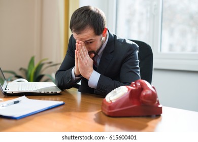 Desperate Businessman Waiting For A Phone Call