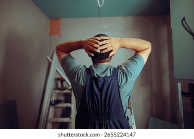 
Desperate Construction Worker Checking the Results 
Contractor looking at a renovation building site noticing mistakes 