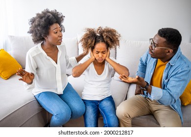 Desperate Littlegirl During Parents Quarrel. Frustrated Little Girl Scared With Mom And Dad Fighting At Home, Sad Stressed Child Suffers From Parents Argument Or Divorce Causing Mental Trauma