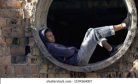 Desperate Lonely Male Teen Thinking Of Problem Abandoned Building, Difficulties