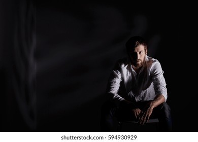 Desperate Man Sitting Alone In Dark Room