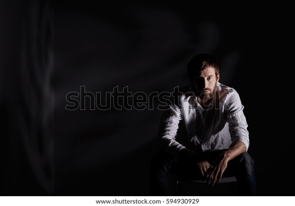 Desperate Man Sitting Alone In Dark Room 0162