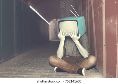 desperate man with television on his head 