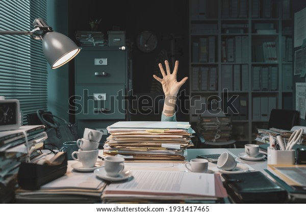 Desperate office worker overwhelmed with\
paperwork, she is asking help with her\
hand