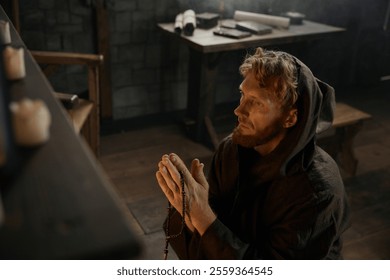 Desperate priest kneeling before church altar in mystical smoke - Powered by Shutterstock