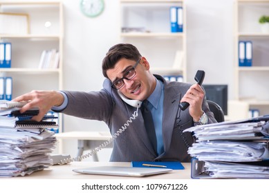 Desperate Sad Employee  Tired At His Desk In Call Center