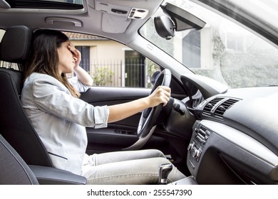 Desperate And Sad Woman In Her Car.