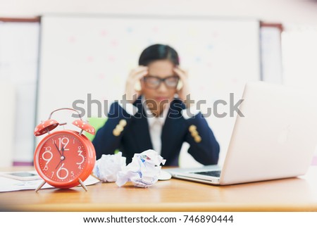Desperate senior businessman being close to ruin - clock showing five minutes to twelve. Business woman tired of working in the office.
