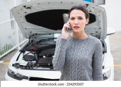 Desperate Woman Calling For Assistance After Breaking Down In A Car Park