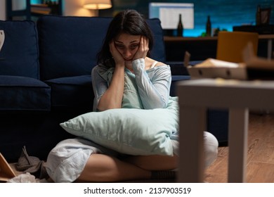 Desperate Woman Dealing With Depression And Anxiety Issues, Having Suicidal Thoughts And Sitting On Living Room Floor. Young Adult With Mental Health And Chronic Disease Difficulties.