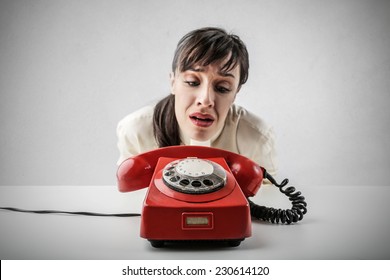 Desperate woman waiting for someone to call her