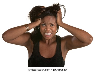 Desperate young African woman pulling on her hair