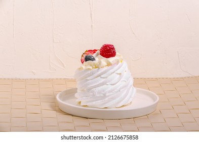 dessert anna pavlova with berries on a white background. High quality photo