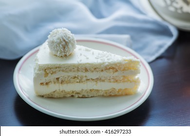 dessert cake with coconut candy balls on the window sill, decorative lamp, soft tissue - Shutterstock ID 416297233
