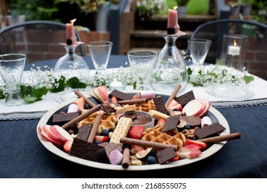 Dessert Charcuterie On A Dressed Dinner Table In The Garden